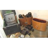 Ross of London stereo prism binoculars in leather case, a pair of Russian binoculars, and a WW2