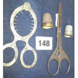 Pair of Victorian ornate steel sewing scissors, “egg” scissors, and two thimbles