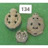 Three cap badges