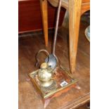 Unusual hanging brass spirit lamp, an Art Nouveau brass & copper trivet, and a copper ladle