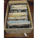 Shoebox of assorted postcards