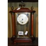 Mantle clock with painted porcelain dial, four glass case flanked by turned wood pillars with