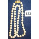 Necklace of pearls with gold clasp