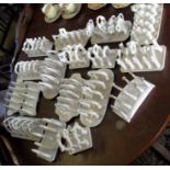 Collection of sixteen white china toast racks
