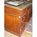 Victorian mahogany sloping kneehole desk with embossed leather inserts and fitted interior