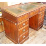 Victorian mahogany sloping kneehole desk with embossed leather inserts and fitted interior