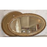 Oval wall mirror in gilt gesso frame, and a Middle Eastern brass tray