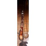 Walking stick with entwined snake and abalone insets, and a bamboo similar