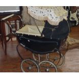 A small vintage "Leeway" coach built pram