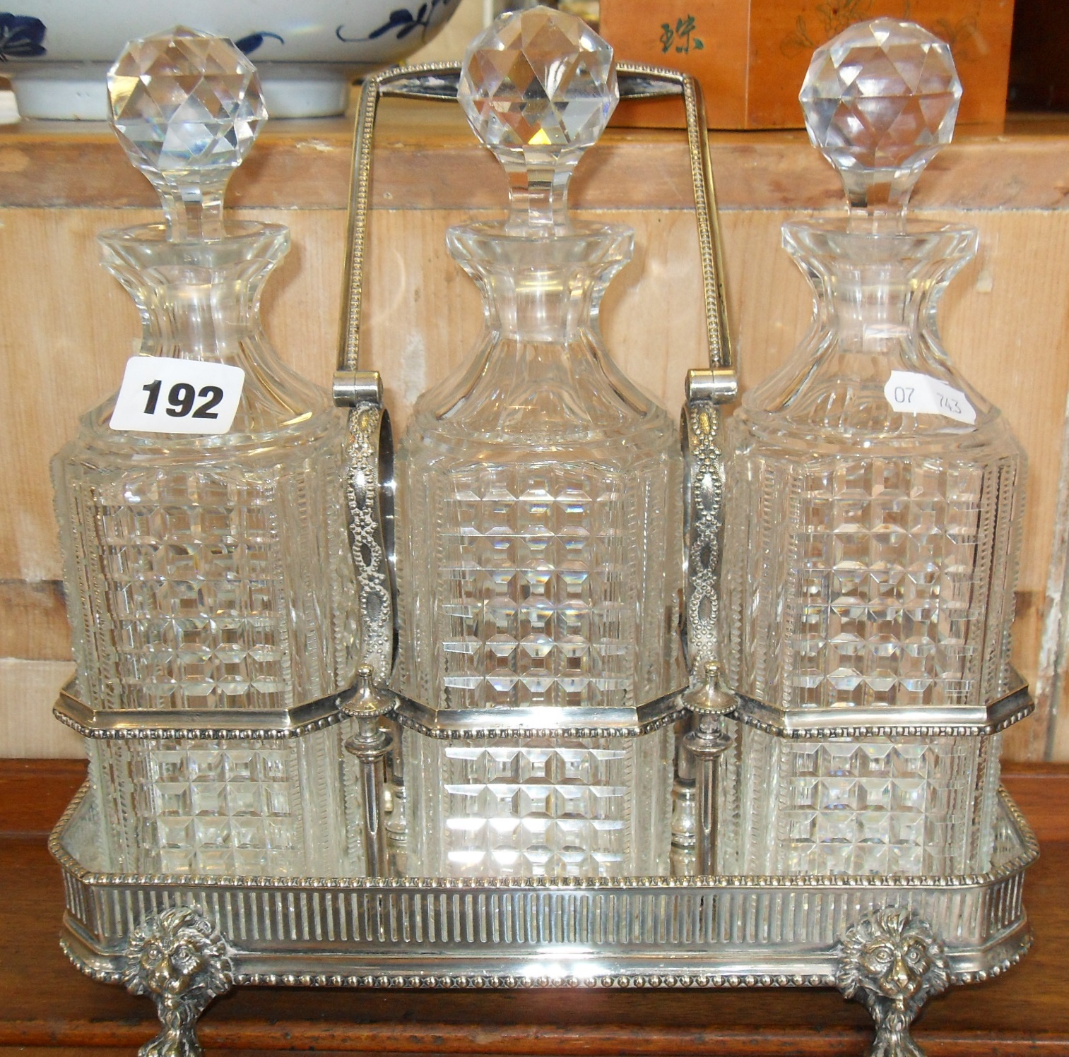 Victorian silver plated tantalus with three decanters