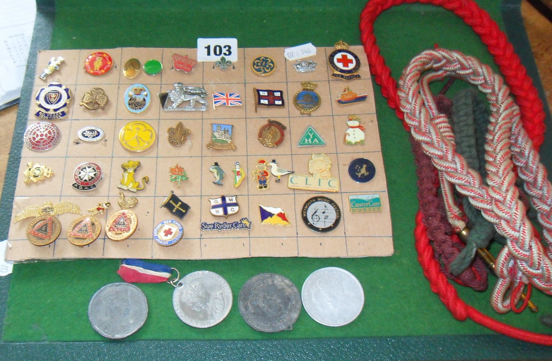 Collection of assorted enamel badges and lanyards etc