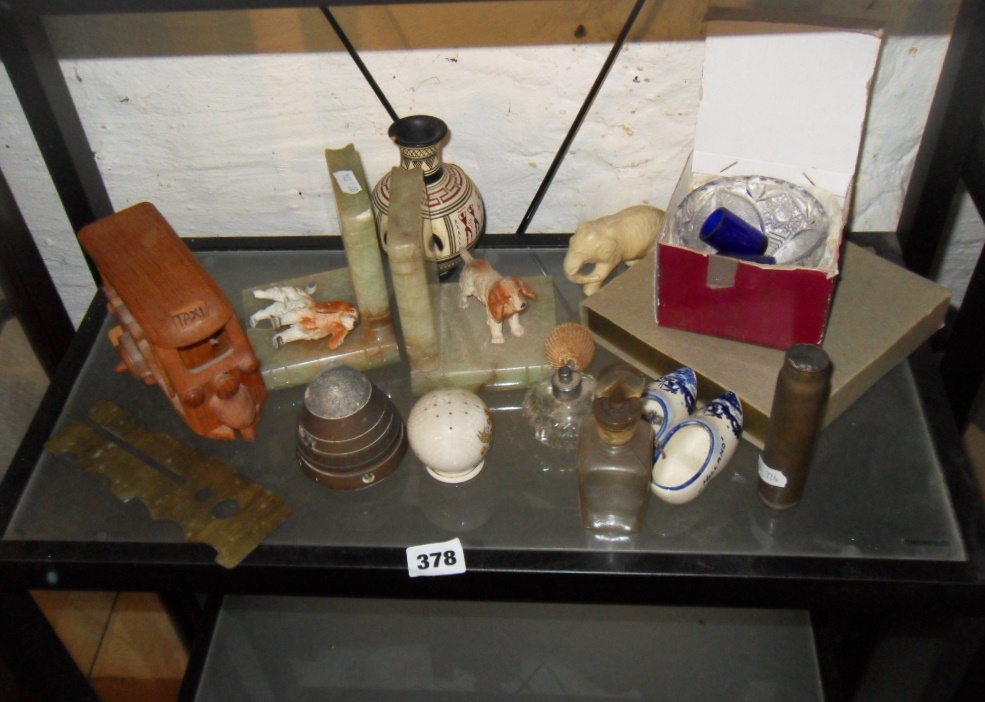 Collection of assorted items including WW2 shell fuse, a pair of bookends with painted cold cast