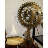 Victorian brass tripod trivet with pierced round fold-down top, and a brass salver on legs
