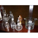 Silver mounted glass decanter, two other decanters, two bottles, a Moet Chandon glass ice bucket,