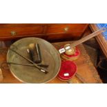 Copper frying pan, iron crimpers, horn beaker, and velvet covered display stands