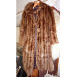 Ladies fur coat with a box of vintage lace, linen, furs and textiles