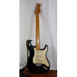 Guitar: Fender Stratocaster Solid guitar, Black, S.N. E215905, U.S.A., with Fender flight case