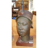 Museum facsimile of a bronze bust of an African native woman