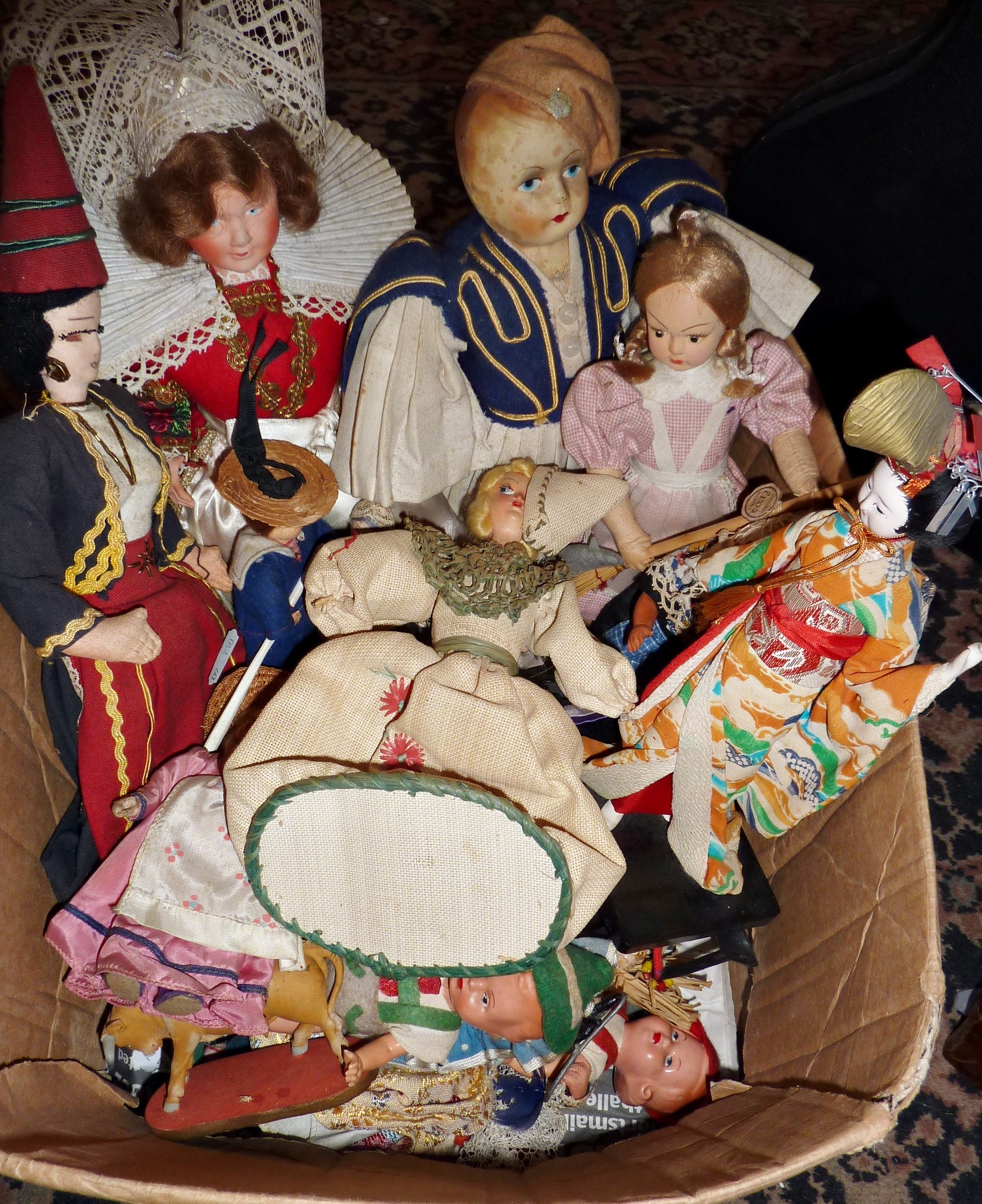 Collection of souvenir dolls including china-headed, cloth & composition examples