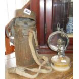 WW2 German gas mask (later filter) with canister, together with a small oil lamp with glass