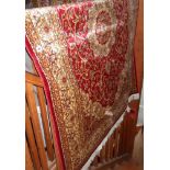 Modern Keshan rug on red ground, 1.90m x 1.40m