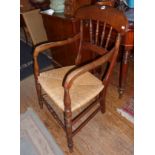 19th c. rush-seated elbow chair with turned splats