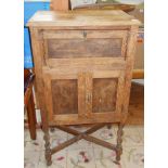 Oak two door cabinet on Barley-twist legs