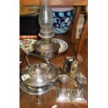 Silver plated kettle on stand, a pair of candlesticks, bookends & an oil lamp