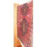 Old Persian red ground rug