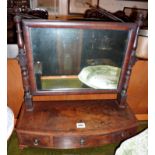 19th c. flame mahogany toilet mirror on three drawer bow-fronted base