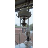 Modern brass hanging lantern and an oil lamp with glass reservoir