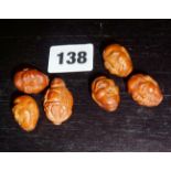 Antique Chinese carved nut beads representing faces and Buddha (6)