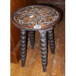 Arts & Crafts-style carved four-legged stool