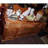 Victorian stripped pine serpentine-fronted dresser base with three drawers above two drawers flanked