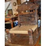 Old Indian carved chair with lattice-work back & woven cord seat