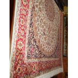 Modern Keshan rug on red ground, 1.90m x 1.40m