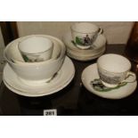 Edwardian china tea cups, saucers and bowls stamped "W. Crapper"