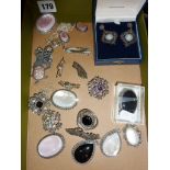 Large quantity of assorted silver jewellery, mainly brooches and pendants, together with a boxed