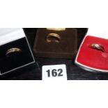 Four 9ct gold rings, some with inset diamonds