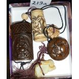 A Japanese hardwood lnro and netsuke depicting demons and a Japanese bone inro carved with