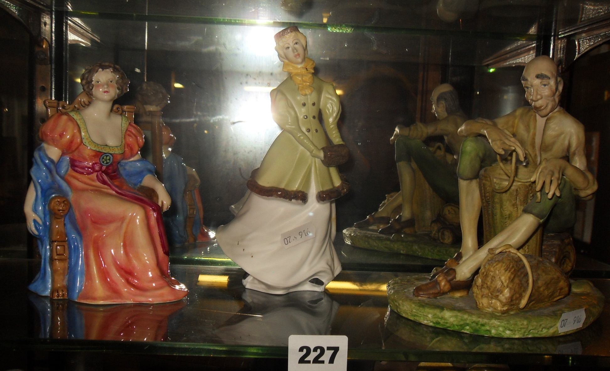 Royal Worcester figurine of "Winter Waltz", a Coalport figurine "Basket Maker" and another