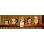 Group of five various miniature character jugs