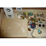 Box containing assorted costume jewellery and bakelite box