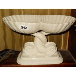 Bisque and white glazed tazza with entwined dolphins base