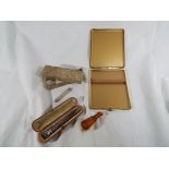 A smokers accessory set including cigarette case, cigar holder,