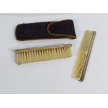 A brush and comb set with silver mounts,