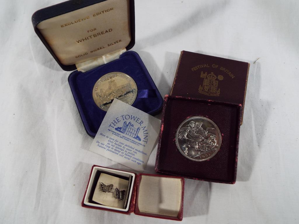 Two coins one of which is a 1951 Festival of Britain Crown Piece five shilling coin in original