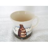 Moorcroft Pottery - a mug decorated with an image of a pottery kiln 8.