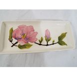 Moorcroft Pottery - a rectangular pen tray decorated with pink magnolia on a cream ground,