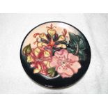 Moorcroft Pottery - a modern shallow bowl / plate decorated in the Oberon pattern,